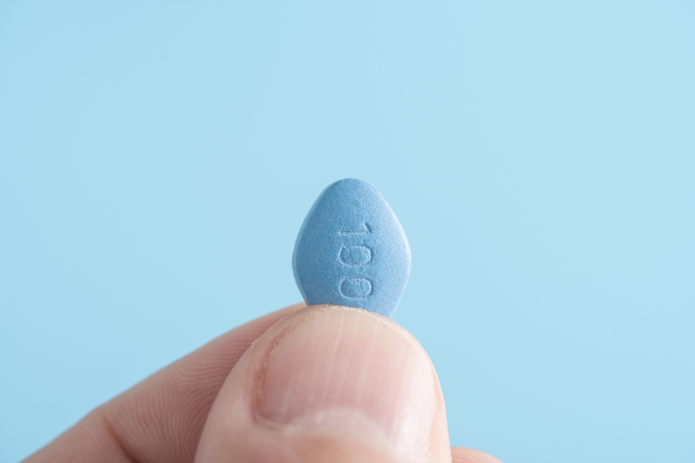 man holding viagra.